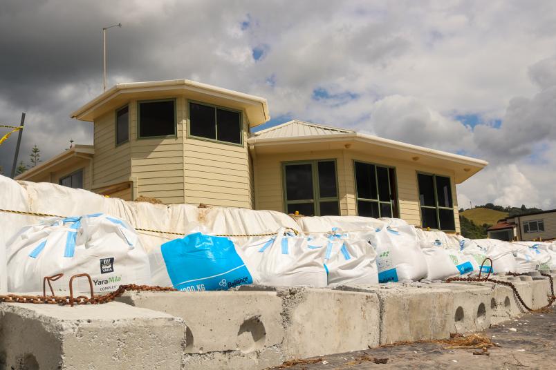 The famed Mercury Bay Boating Club was left teetering on the water's edge by Cyclone Hale. Photo / Eduan Roos 